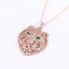 Diamond Tiger Head Pendant in rose gold with green eyes, featuring intricate detailing and a shimmering finish.