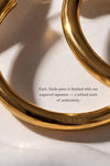 Gold dangle earrings featuring an engraved Akalia signature, showcasing elegance and authenticity. Waterproof design.