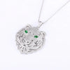 Diamond tiger head pendant with green eyes, available in gold, silver, and rose gold finishes. Perfect statement piece.