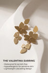 Gold statement dangle earrings with a lightweight cascading design, waterproof and hypoallergenic for sensitive skin.