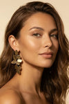 Close-up of a model showcasing the Valentina Waterproof Statement Dangle Earring with a natural makeup look.